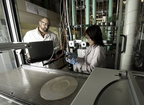 NREL researchers investigating solar technologies. Courtesy NREL.