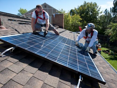 REC installing solar on home
