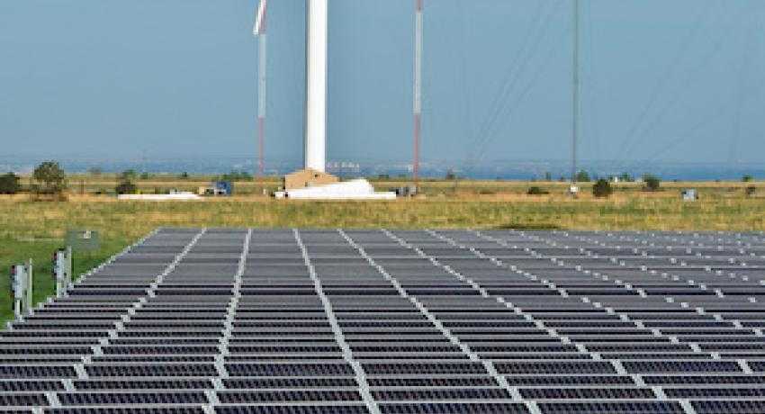 A solar farm and wind turbine